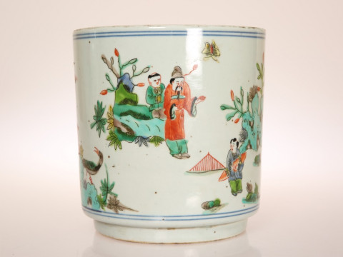 A CHINESE PORCELAIN BRUSH POT, IN KANGXI STYLE, of cylindrical form, painted...