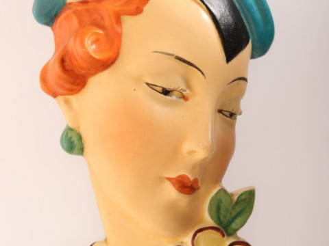 A ROYAL DUX CZECHOSLOVAKIA POTTERY WALL MASK, c. 1930, modelled as a red-headed...