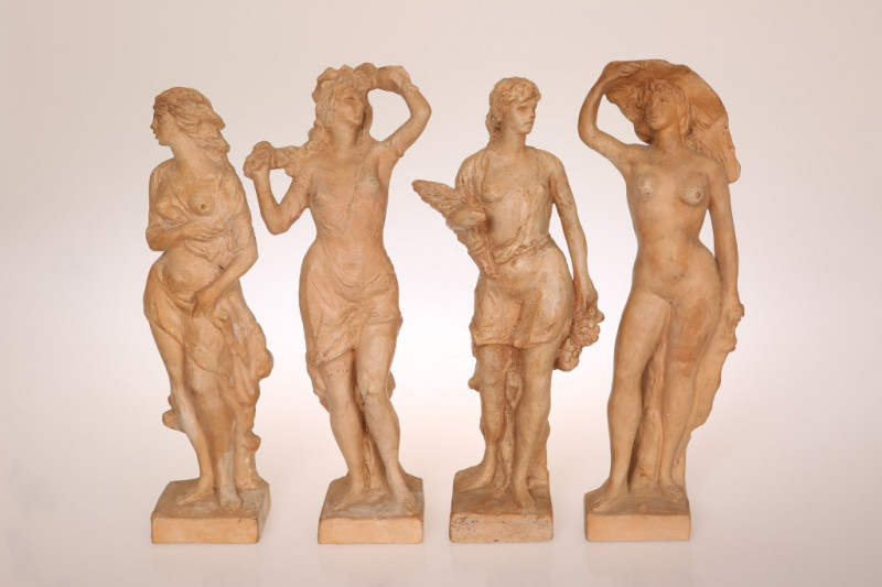 M. BANDINI (ITALIAN, 20th CENTURY), A SET OF FOUR TERRACOTTA FIGURES EMBLEMATIC OF THE SEASONS, each modelled as a female nude, with incised signature and inscribed 'Vezzani Florence' to the base. 31cm