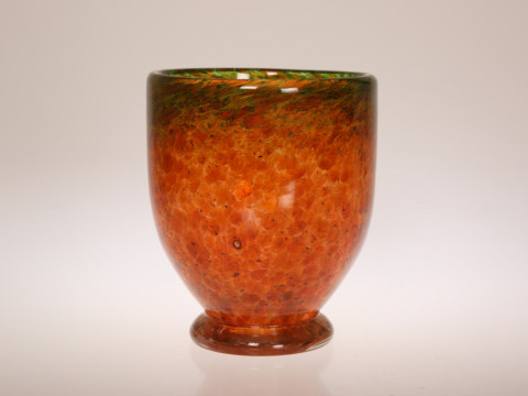 A MONART FOOTED VASE, orange glass with green aventurine inclusions. 16.5cm