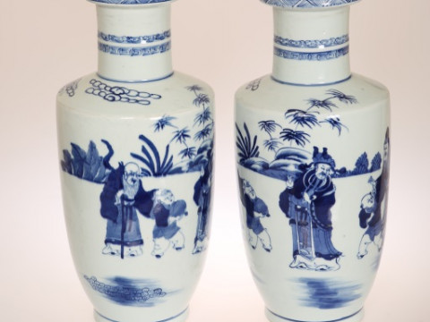 A NEAR PAIR OF CHINESE BLUE AND WHITE ROULEAU VASES, each painted with...