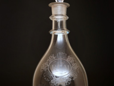 AN ENGRAVED GLASS MALLET-FORM DECANTER, circa 1790, engraved 'Rum' within...