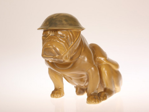 A ROYAL DOULTON 'TOMMY' BULLDOG, modelled seated, in helmet and with Sam...