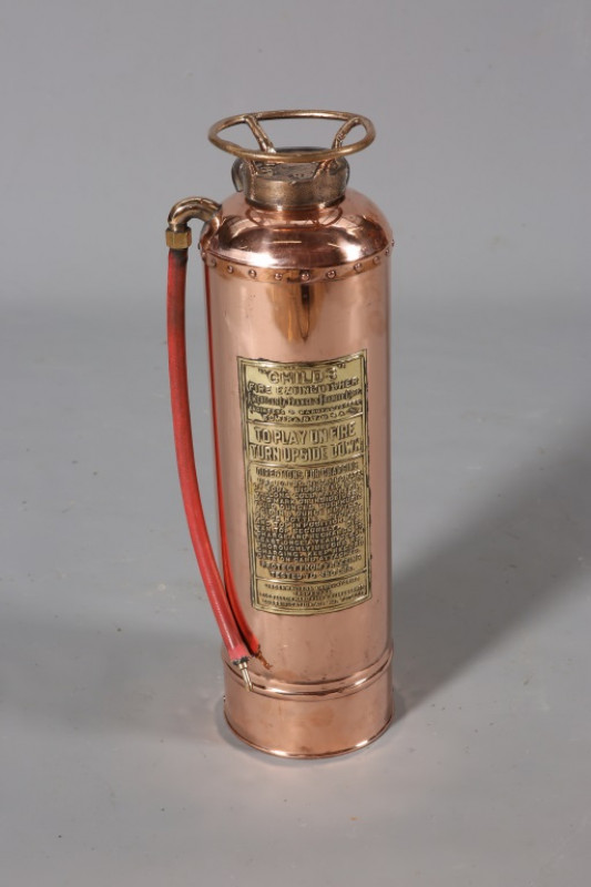 A POLISHED COPPER AND BRASS CHILD'S FIRE EXTINGUISHER, 62cm