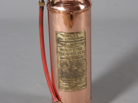 A POLISHED COPPER AND BRASS CHILD'S FIRE EXTINGUISHER, 62cm