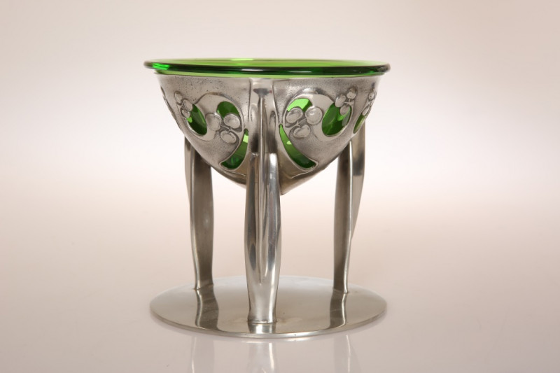 ARCHIBALD KNOX (1864-1933) FOR LIBERTY & CO A TUDRIC PEWTER COUPE, no. 0276, with green glass liner. 14cm