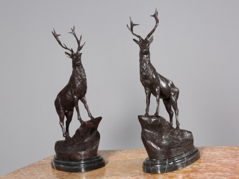 AFTER MOIGNIEX, A LARGE PAIR OF BRONZE STAGS, on stepped marble bases....