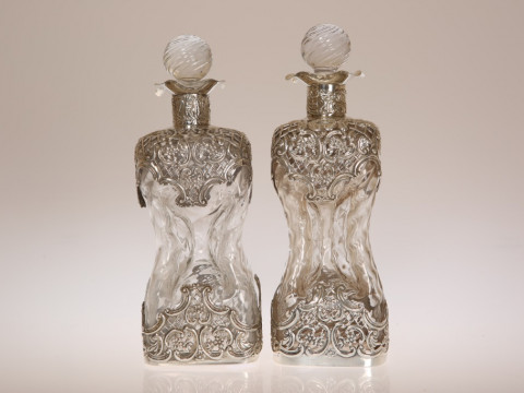 A PAIR OF LATE VICTORIAN SILVER-MOUNTED WRYTHEN GLASS DECANTERS, William...