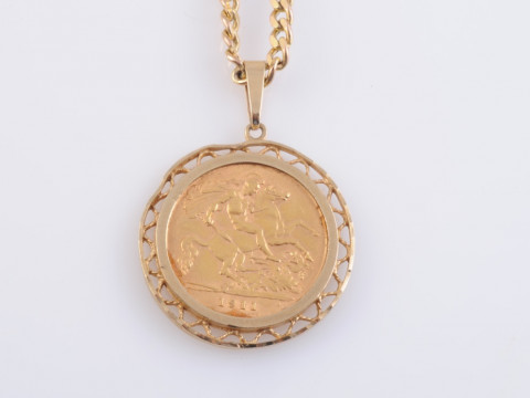 AN EDWARDIAN HALF SOVEREIGN, 1911, in a pendant mount with a chain stamped...