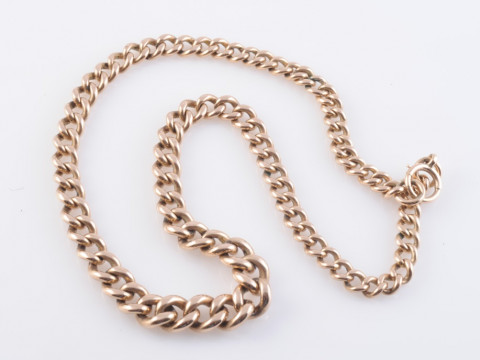 A 9 CARAT GOLD CURB LINK WATCH CHAIN. 44 grams, 40.5cm long