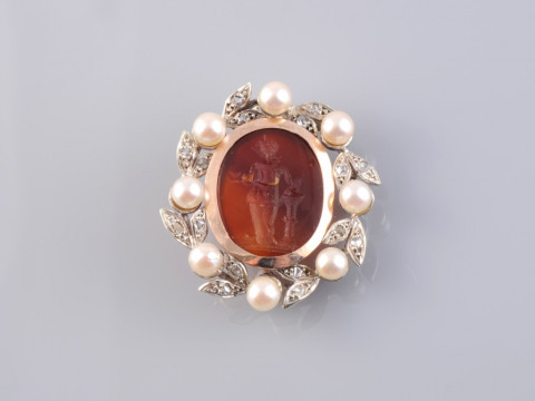 A CARNELIAN, CULTURED PEARL AND DIAMOND BROOCH, the carved oval carnelian...