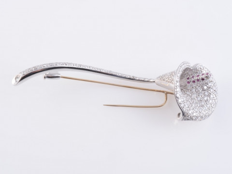 A CONTEMPORARY DIAMOND AND RUBY SET BROOCH, modelled as a calla lily,...