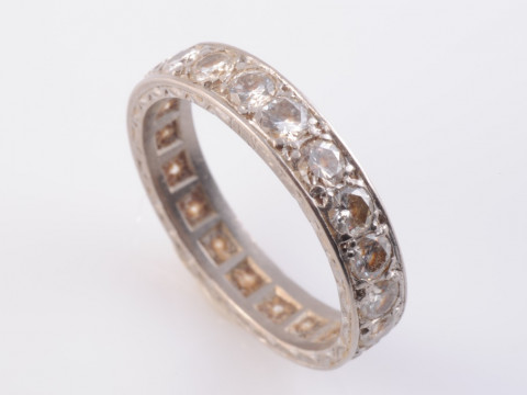 A DIAMOND ETERNITY RING, the twenty brilliant cut diamonds set to the...