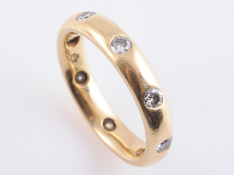 A DIAMOND RING, possibly by Mappin and Webb, the eight brilliant cut diamonds...