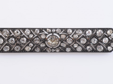 A DIAMOND SET BROOCH, circa 1880-1890, the navette shaped pierced detail...