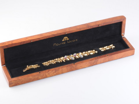 A DIAMOND, RUBY AND SAPPHIRE BRACELET BY MAURICE LACROIX, composed of...