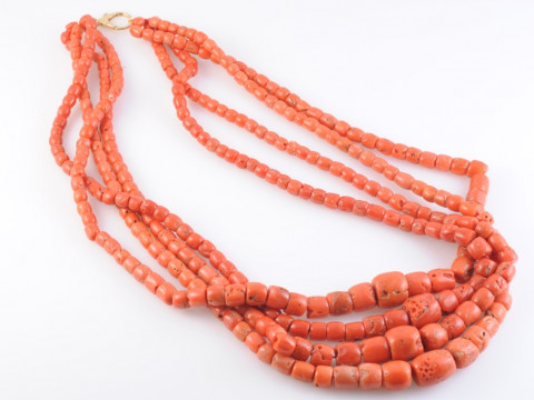 A FOUR ROW CORAL NECKLACE, the three hundred and thirty graduating rounded...