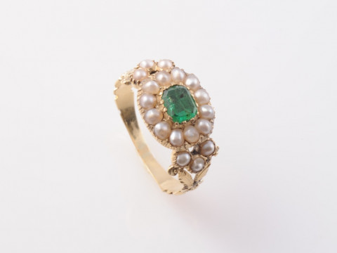 A GEORGIAN EMERALD AND PEARL RING, the rectangular cut emerald claw set...