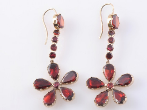 A PAIR OF GARNET EARRINGS, circa 1900, the five pear mixed cut garnets...