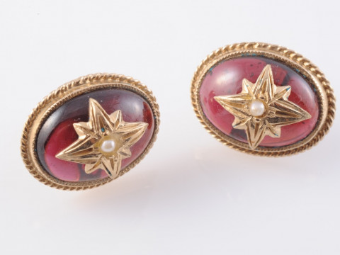 A PAIR OF GARNET STUD EARRINGS, circa 1890-1900, the oval cabochon cut...