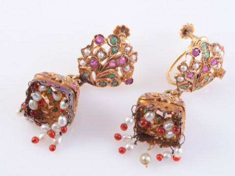 A PAIR OF INDIAN RUBY, EMERALD AND SEED PEARL EARRINGS, the heavily moulded...