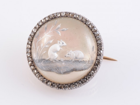 A REVERSE INTAGLIO BROOCH, circa 1870-1880, the circular domed mount depicting...