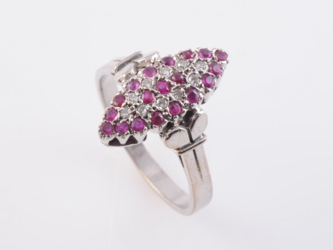 A RUBY AND DIAMOND RING, the marquise shaped mount set throughout with...