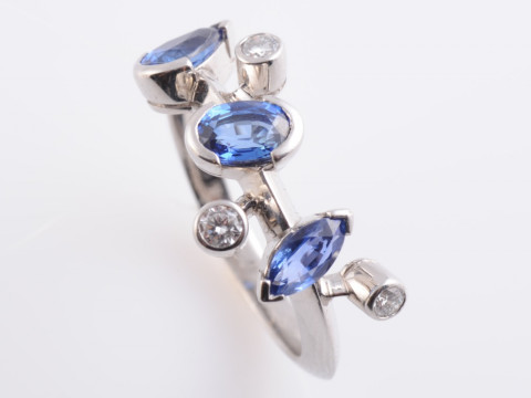 A SAPPHIRE AND DIAMOND RING BY CARTIER, from the Meli Melo range, the...