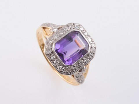 AN AMETHYST AND DIAMOND RING, circa 1890-1900, the cut-cornered square...
