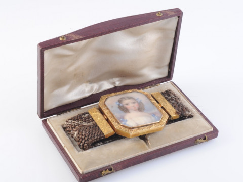 AN EARLY VICTORIAN HAIR MEMORIAL BRACELET, the wide bracelet of plaited...