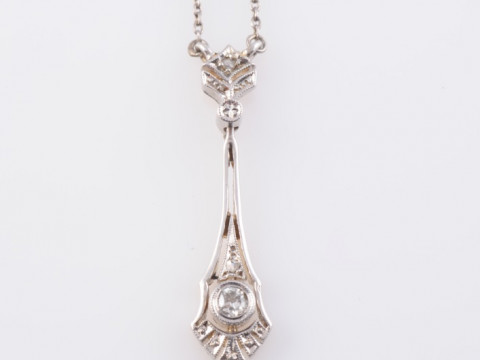 AN EDWARDIAN DIAMOND SET PENDANT, the simple tapering oval pendant with...
