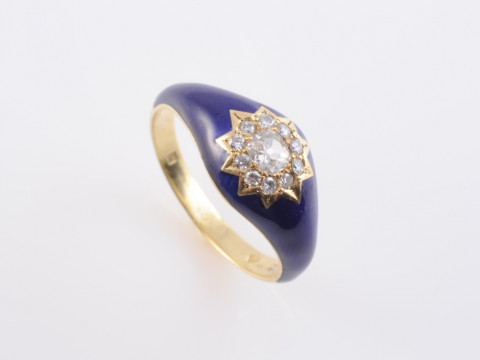AN ENAMEL AND DIAMOND RING, the tapering oval mount of blue enamelling...