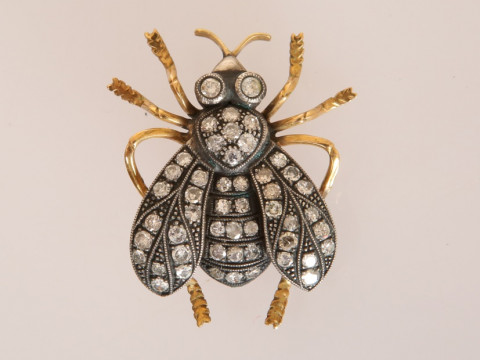 A DIAMOND SET INSECT BROOCH, the realistically moulded inset set throughout...