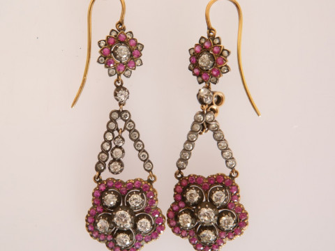 A PAIR OF RUBY AND DIAMOND EARRINGS, the six old brilliant cut diamonds...