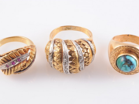 THREE GOLD RINGS, to include a gold and turquoise set ring, the turquoise...