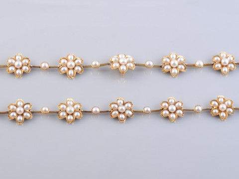 TWO PEARL SET BRACELETS, circa 1900, each of matching design composed...
