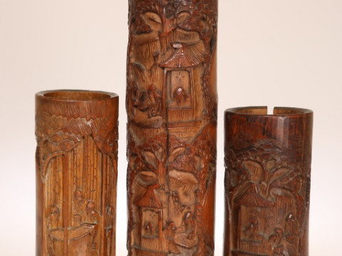 THREE CHINESE BAMBOO VASES, each of cylindrical form, variously carved...