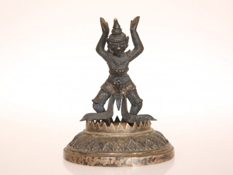A SINO-TIBETAN BRONZE FIGURE, cast with arms aloft and bent at the knee,...
