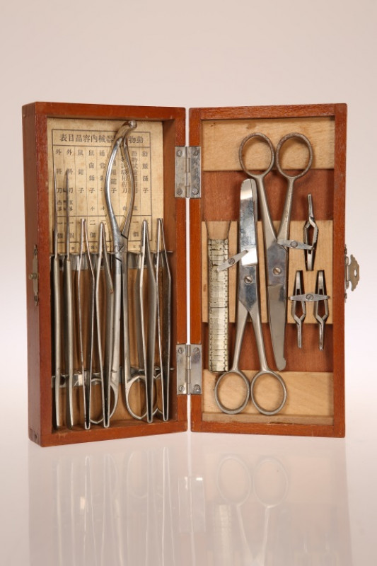 A JAPANESE ARMY FIELD DOCTOR'S SURGICAL KIT, World War II period, the instruments contained in a fitted wooden box with original pamphlet. Length of box 19.5cm Note: allegedly obtained on the island of Okinawa