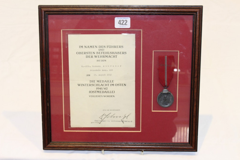 A GERMAN WORLD WAR II WINTERSCHLACHT IM OSTEN (OSTMEDAILLE) MEDAL, Russian Front 1941/42, framed with original citation to B.-Uffz. Hermann Schrader and dated 19th August 1942. 