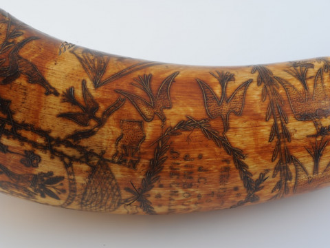 AN AUSTRALIAN POWDER HORN, with scrimshaw decoration of a ship in full sail, opposed by an inscription 'Presented to J. C. Low.....Jimbour, Queensland 1862' in a cartouche amidst birds and flags, inscribed with makers name Colvin or Corvin?. Length 33cm thumbnail