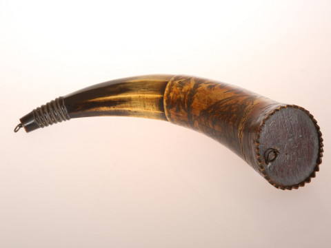 AN AUSTRALIAN POWDER HORN, with scrimshaw decoration of a ship in full sail, opposed by an inscription 'Presented to J. C. Low.....Jimbour, Queensland 1862' in a cartouche amidst birds and flags, inscribed with makers name Colvin or Corvin?. Length 33cm thumbnail