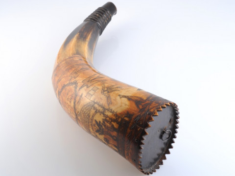 AN AUSTRALIAN POWDER HORN, with scrimshaw decoration of a ship in full sail, opposed by an inscription 'Presented to J. C. Low.....Jimbour, Queensland 1862' in a cartouche amidst birds and flags, inscribed with makers name Colvin or Corvin?. Length 33cm thumbnail