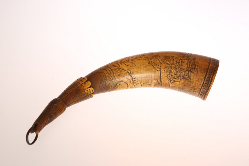 A 19TH CENTURY SCRIMSHAW DECORATED HORN, engraved with mermaid, lion, fish and crown, (a/f). 30cm