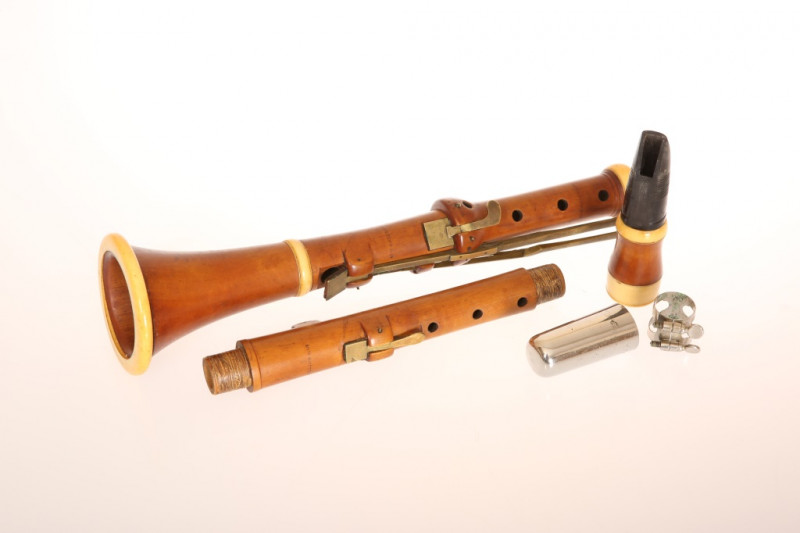 A 19th CENTURY IVORY MOUNTED BOXWOOD CLARINET, GOULDING & CO., in four sections, each with stamped maker's mark. Length 59cm