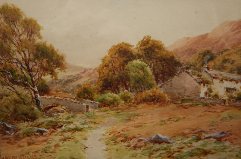 HARRY STICKS (1867-1938), COTTAGES BY AN OLD STONE BRIDGE, signed lower left, watercolour, framed. 18.5cm by 27cm