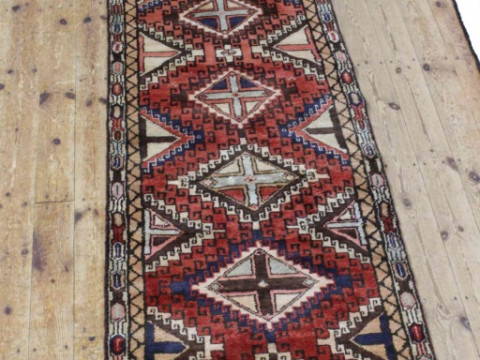 A HERIZ RUNNER. 304cm by 80cm