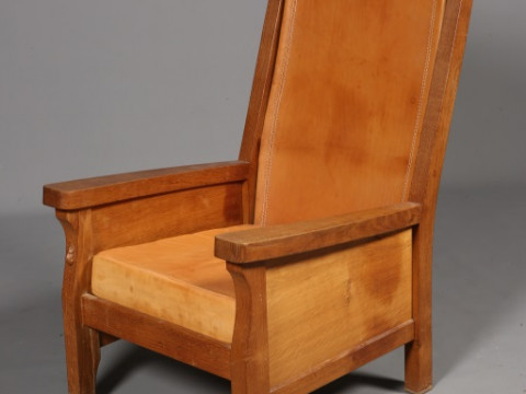 ROBERT THOMPSON OF KILBURN, A MOUSEMAN OAK AND LEATHER SMOKING CHAIR,...
