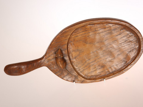 ROBERT THOMPSON OF KILBURN, A RARE MOUSEMAN CHEESEBOARD, of dished oval...