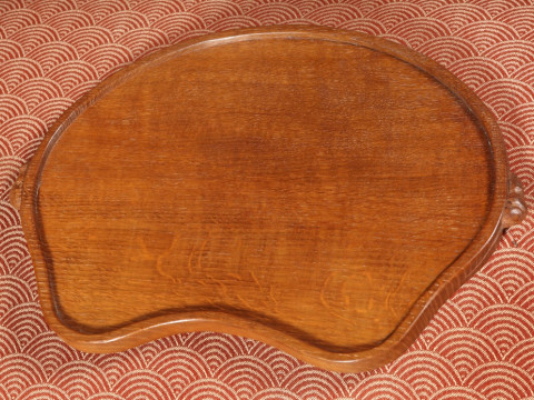 ROBERT THOMPSON OF KILBURN, A MOUSEMAN OAK TEA TRAY, kidney-shaped, with...